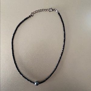 Beaded choker with a dark gray pearl